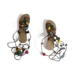 Mystique Boutique Pom Pom gladiator sandals. NWOT and comes with bag